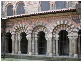 Cloister, south gallery with cornice illustrating a medieval bestiary & north side of nave, Le Puy Cathedral