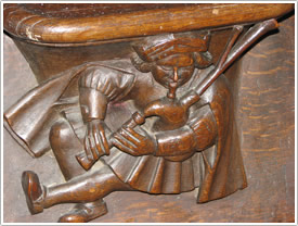 Bagpiper on choir stall miserichord (late 15th c.), Abbaye de la Trinit&eacute;, Vend&ocirc;me