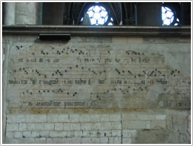 Music on wall of south choir, Basilique, St-Quentin