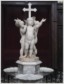 'Three Infants at the Foot of the Cross' (Jouffroy, 19th c.), south transept, Église St-Germain-l'Auxerrois, Paris click for full-size image