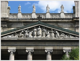 Column capitals, pediment & statues on façade, St-Vincent-de-Paul, Paris click for full-size image