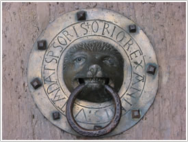 Bronze lion door knocker, south porch door (12th c.), St-Julien, Brioude click for full-size image