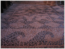 Pebble pavement floor (16th c.), north nave, St-Julien, Brioude click for full-size image