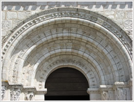 Tympanum above Romanesque west portal (12th c.), Église St-Michel, Lescure click for full-size image
