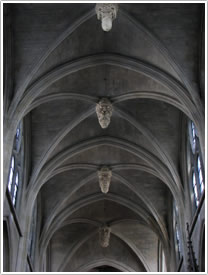 Nave vault (1655-59) with historiated bosses, looking east, St-Laurent, Paris click for full-size image