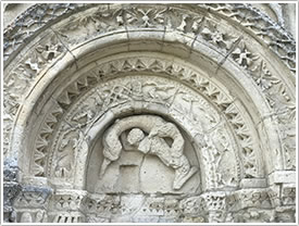 West façade, left side arch archivolt (1140-70), St-Martin, Chadenac click for full-size image
