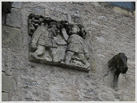 Wrestlers on right side of west front (12th c.), St-Blaise, La Celle (near Bourges) click for full-size image